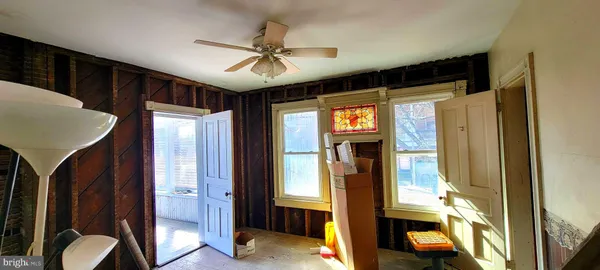 a view of an entryway with wooden floor