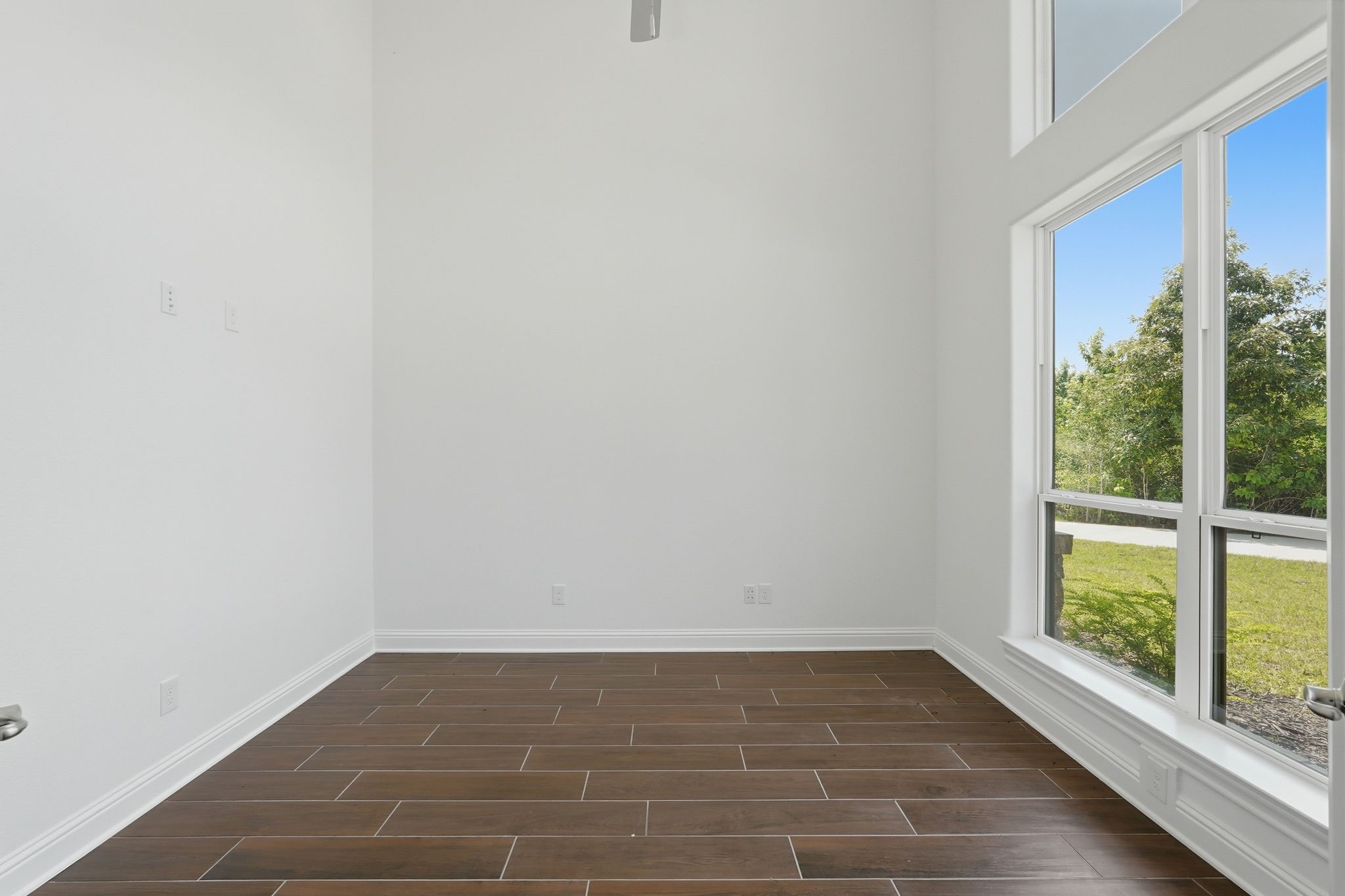 16081 Forest Mill Road Willis, TX 77378 - Photo 5 of 37 Private home office with oversized picture windows, abundant natural light, and peaceful views - perfect for home office.