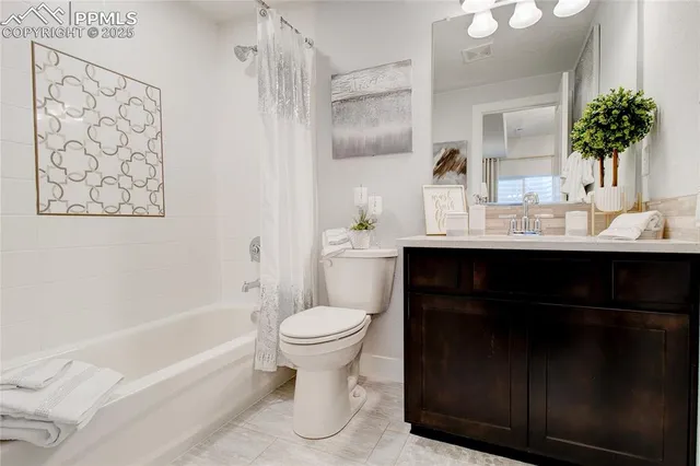 a bathroom with a sink toilet a mirror and shower