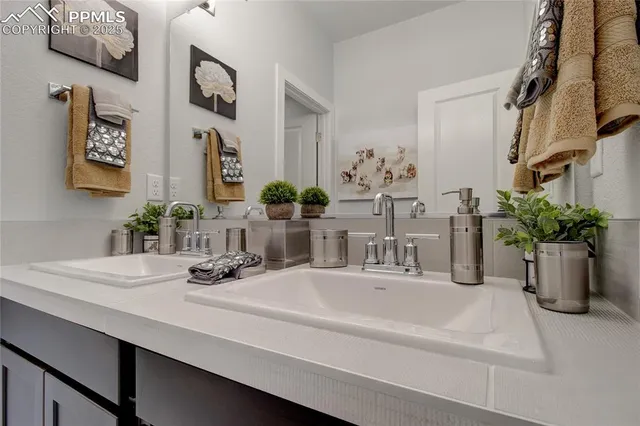 a bedroom with a bed and a mirror