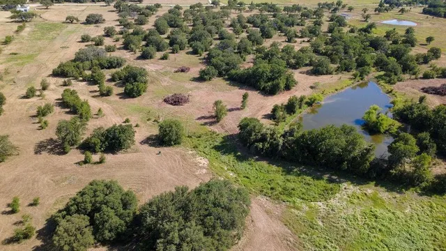 an aerial view of mountain with yard