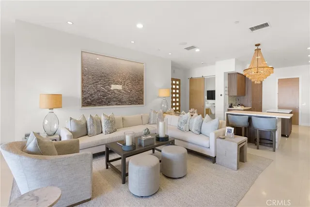 a living room with furniture and a painting