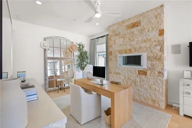 a workspace with furniture and chandelier