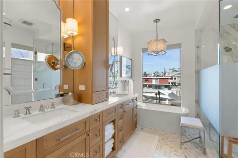 a spacious bathroom with a granite countertop sink a mirror and shower