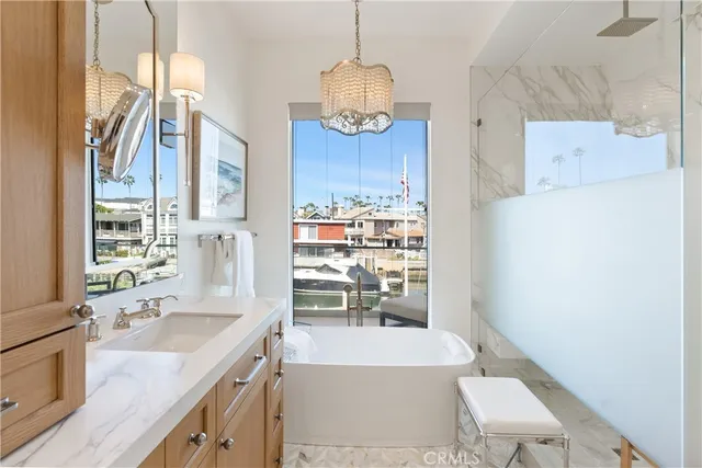 a bathroom with a granite countertop sink a toilet and bathtub