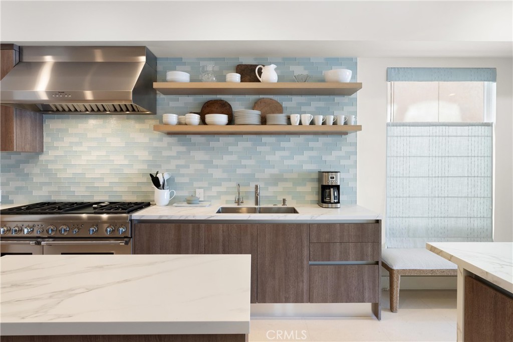 3306 Marcus Avenue Newport Beach, CA 92663 - Photo 3 of 36 a kitchen with stainless steel appliances granite countertop a sink dishwasher stove and cabinets