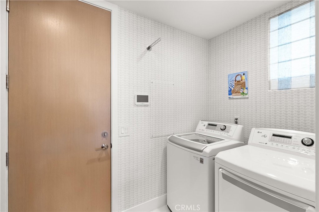 3306 Marcus Avenue Newport Beach, CA 92663 - Photo 32 of 36 a utility room with dryer and washer