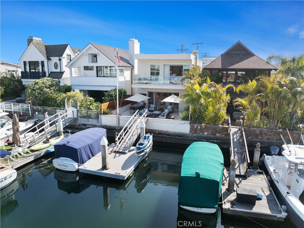 3306 Marcus Avenue Newport Beach, CA 92663 - Photo 34 of 36 a view of a patio with chairs under an umbrella