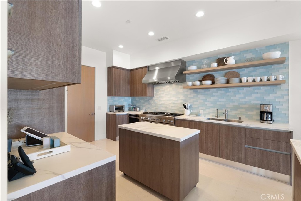 3306 Marcus Avenue Newport Beach, CA 92663 - Photo 6 of 36 a kitchen that has a sink and a stove in it