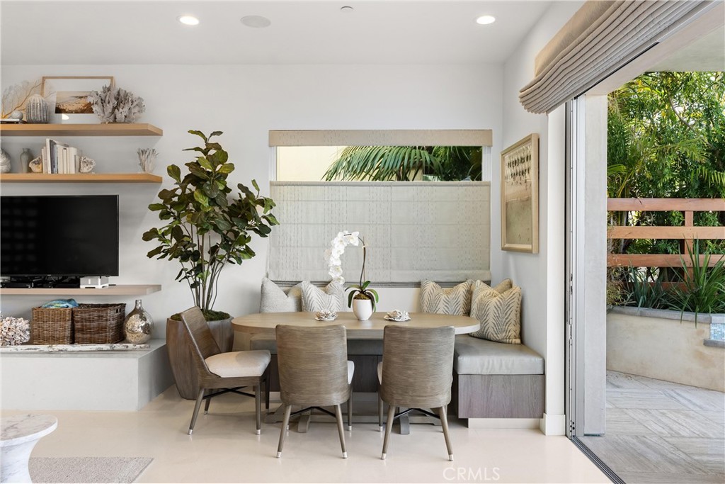 3306 Marcus Avenue Newport Beach, CA 92663 - Photo 9 of 36 a living room with furniture a lamp and a potted plant
