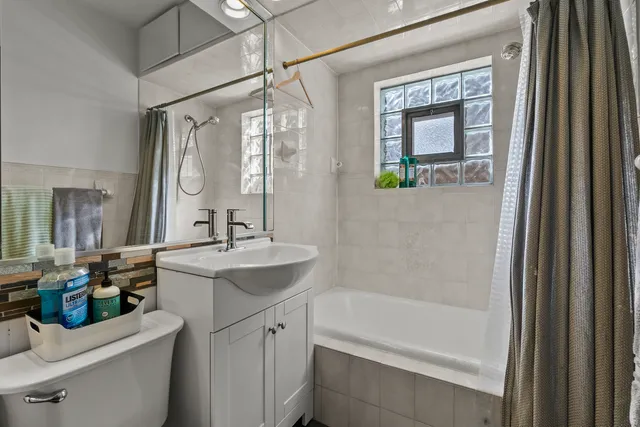 a view of a room with workspace and music instruments