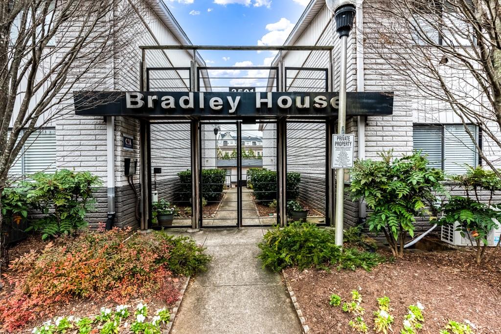 3501 Roswell Road Northeast, Unit 103 Atlanta, GA 30305 - Photo 1 of 13 a view of a pathway along a building