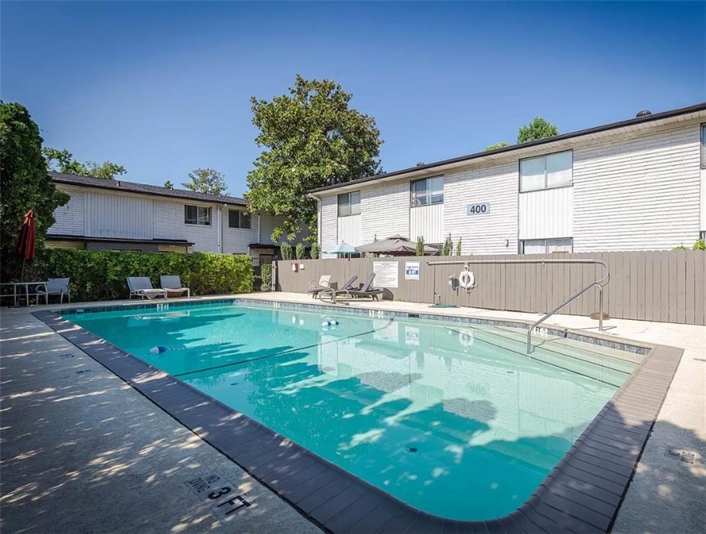 3501 Roswell Road Northeast, Unit 103 Atlanta, GA 30305 - Photo 13 of 13 a view of a swimming pool with a patio