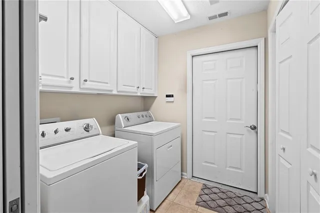 a view of storage and utility room with washer and dryer