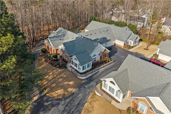 an aerial view of a house with a yard