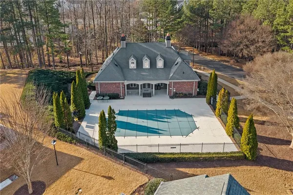 an aerial view of a house with a yard