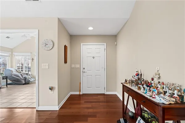 a view of a hallway and dining room