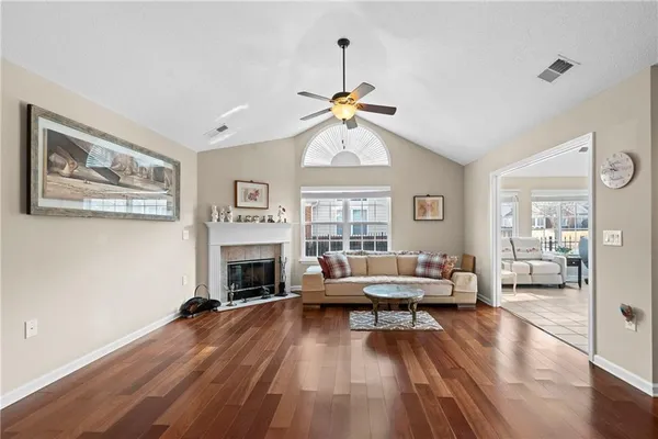 a living room with furniture and a fireplace