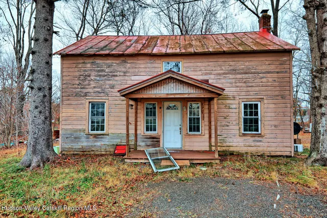 a backyard of a house with barbeque oven