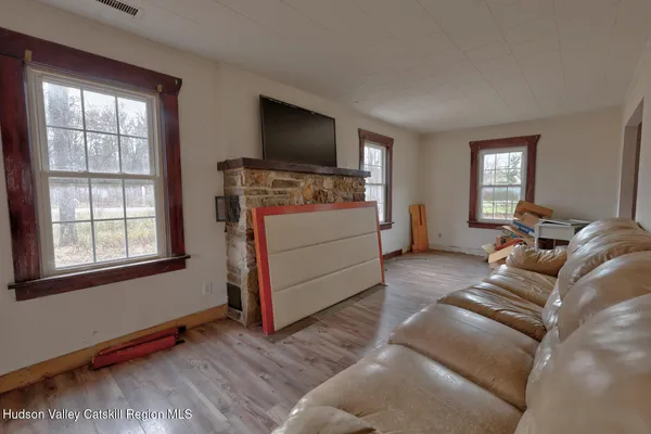 a living room with furniture and stairs