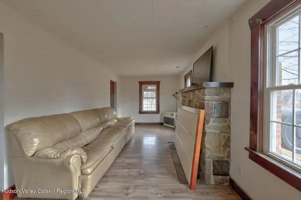 a view of entryway and hall with wooden floor