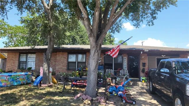 a view of street with retail shops