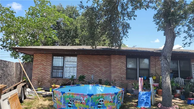 a view of house with outdoor seating