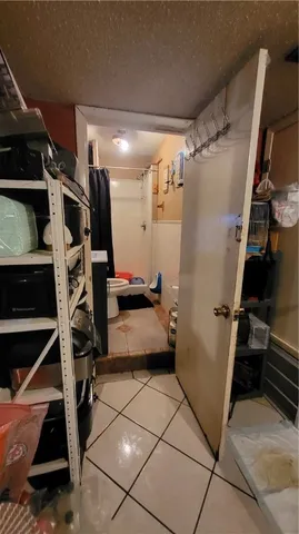 a bed room with a bed and a chandelier