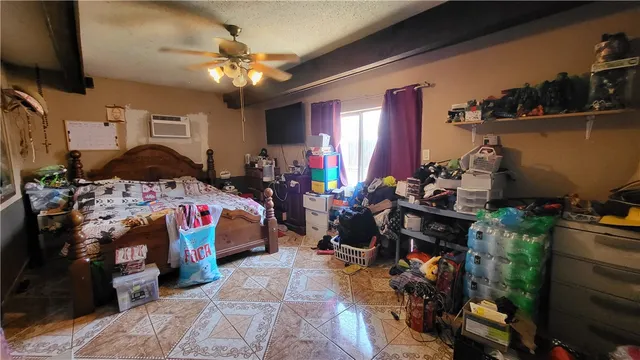 a bed room with a bed and a desk