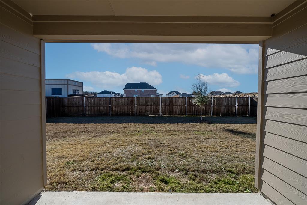 1260 Sharp Street Anna, TX 75409 - Photo 31 of 35 Large backyard with covered patio