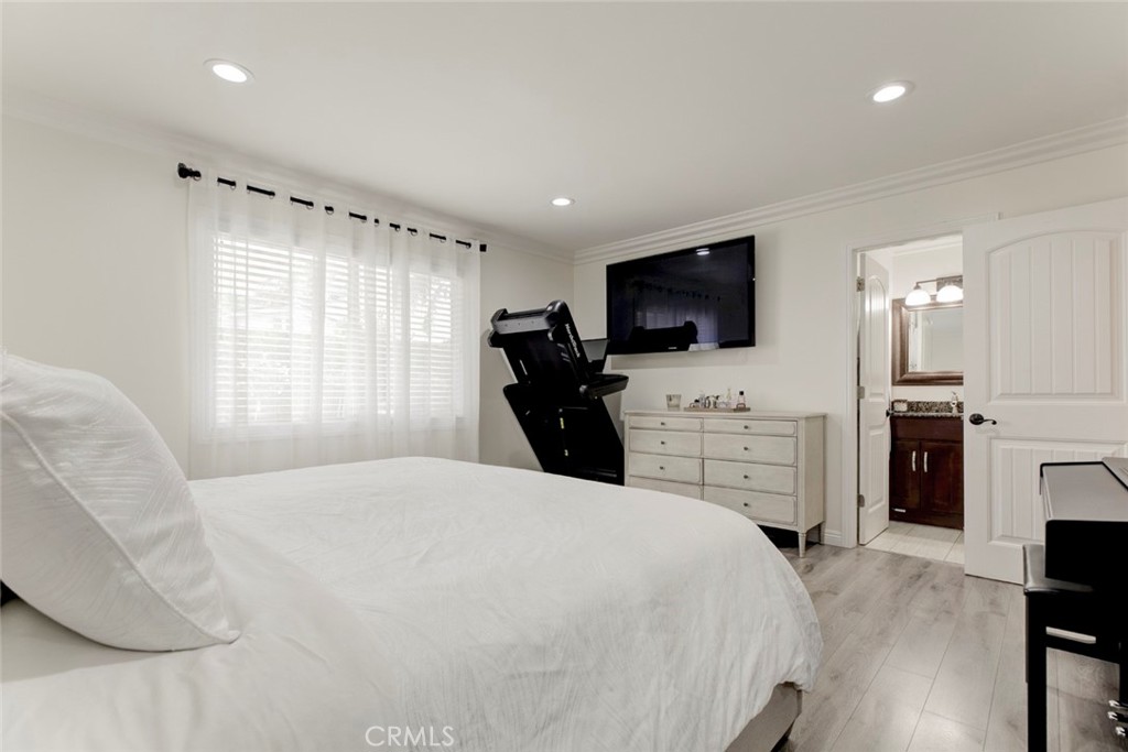 9350 Rhea Avenue Northridge, CA 91324 - Photo 10 of 20 a large bedroom with a bed and a flat screen tv