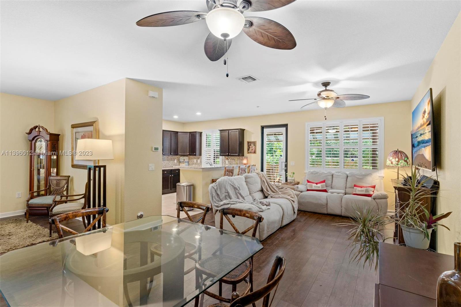 12120 Village Place Davie, FL 33325 - Photo 11 of 35 a living room with furniture kitchen view and a large window