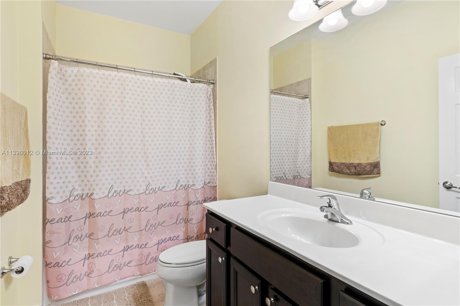 12120 Village Place Davie, FL 33325 - Photo 15 of 35 a bathroom with a sink and a mirror