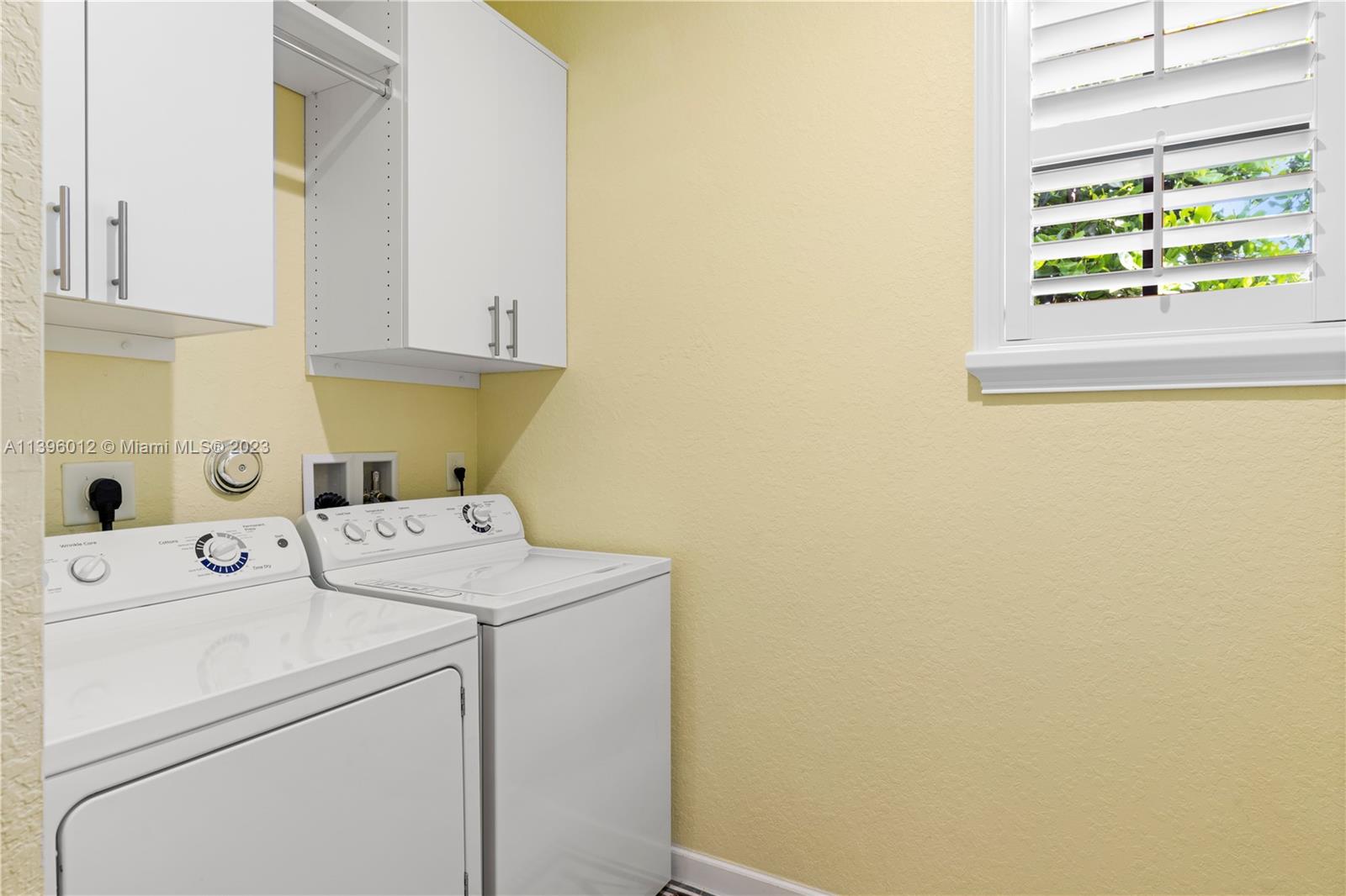 12120 Village Place Davie, FL 33325 - Photo 16 of 35 a utility room with dryer and washer