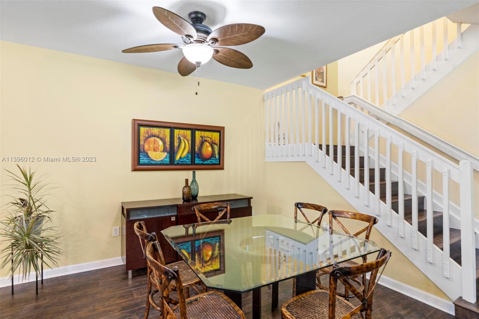 12120 Village Place Davie, FL 33325 - Photo 18 of 35 a view of a dining room with furniture and wooden floor