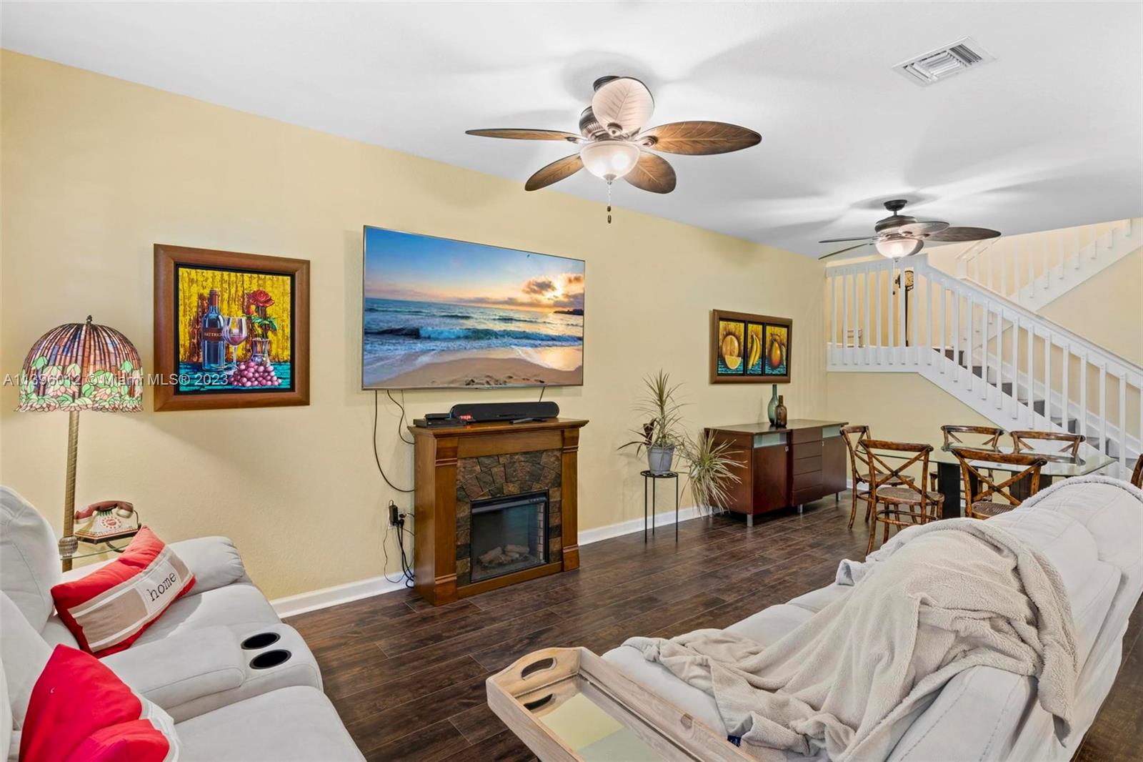 12120 Village Place Davie, FL 33325 - Photo 21 of 35 a living room with furniture and a fireplace