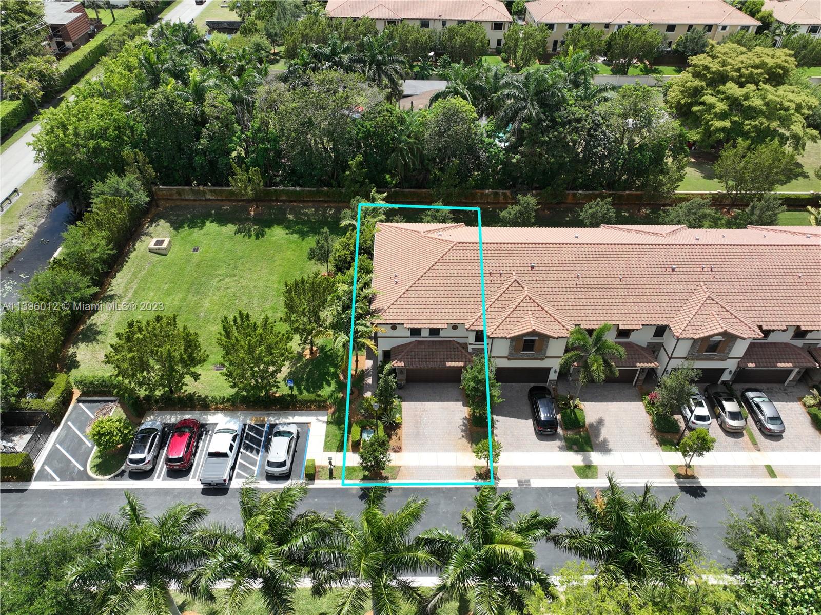 12120 Village Place Davie, FL 33325 - Photo 30 of 35 an aerial view of a house with garden space and street view