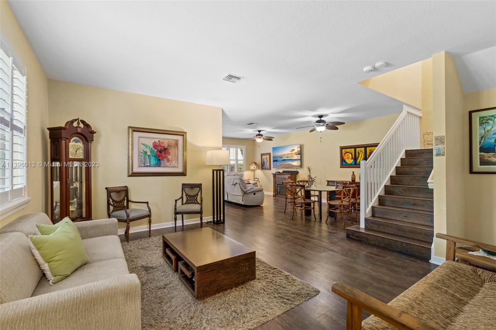 12120 Village Place Davie, FL 33325 - Photo 6 of 35 a living room with furniture and wooden floor