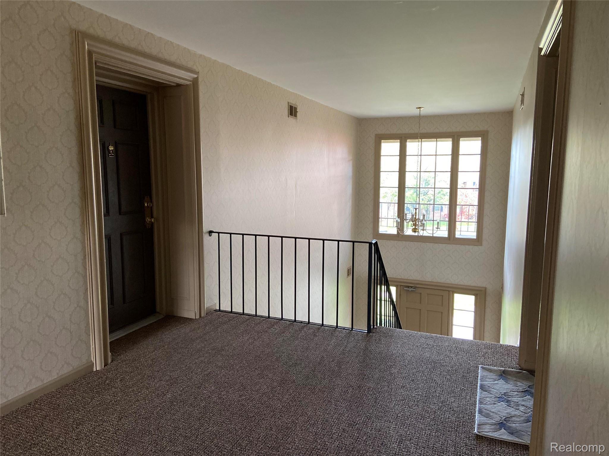29644 Middlebelt Road, Unit 54 Farmington, MI 48334 - Photo 8 of 31 upstairs landing is very well cared for and boasts loads of natural sunlight