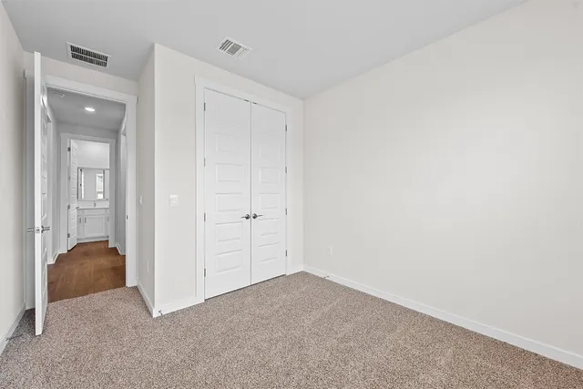 wooden floor and closet in a room
