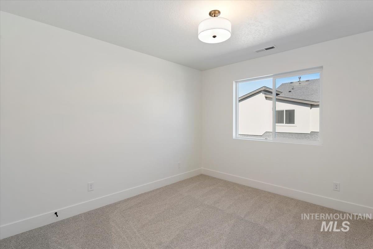 752 South Calhoun Lane Star, ID 83669 - Photo 23 of 45 Room with light gray carpet flooring and white painted walls