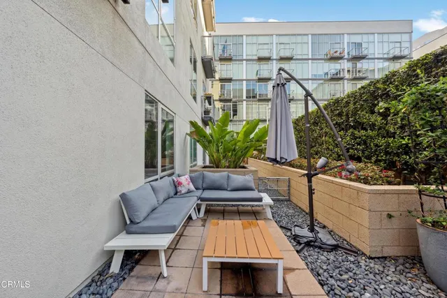 a view of balcony with furniture