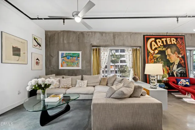 a living room with furniture and a window