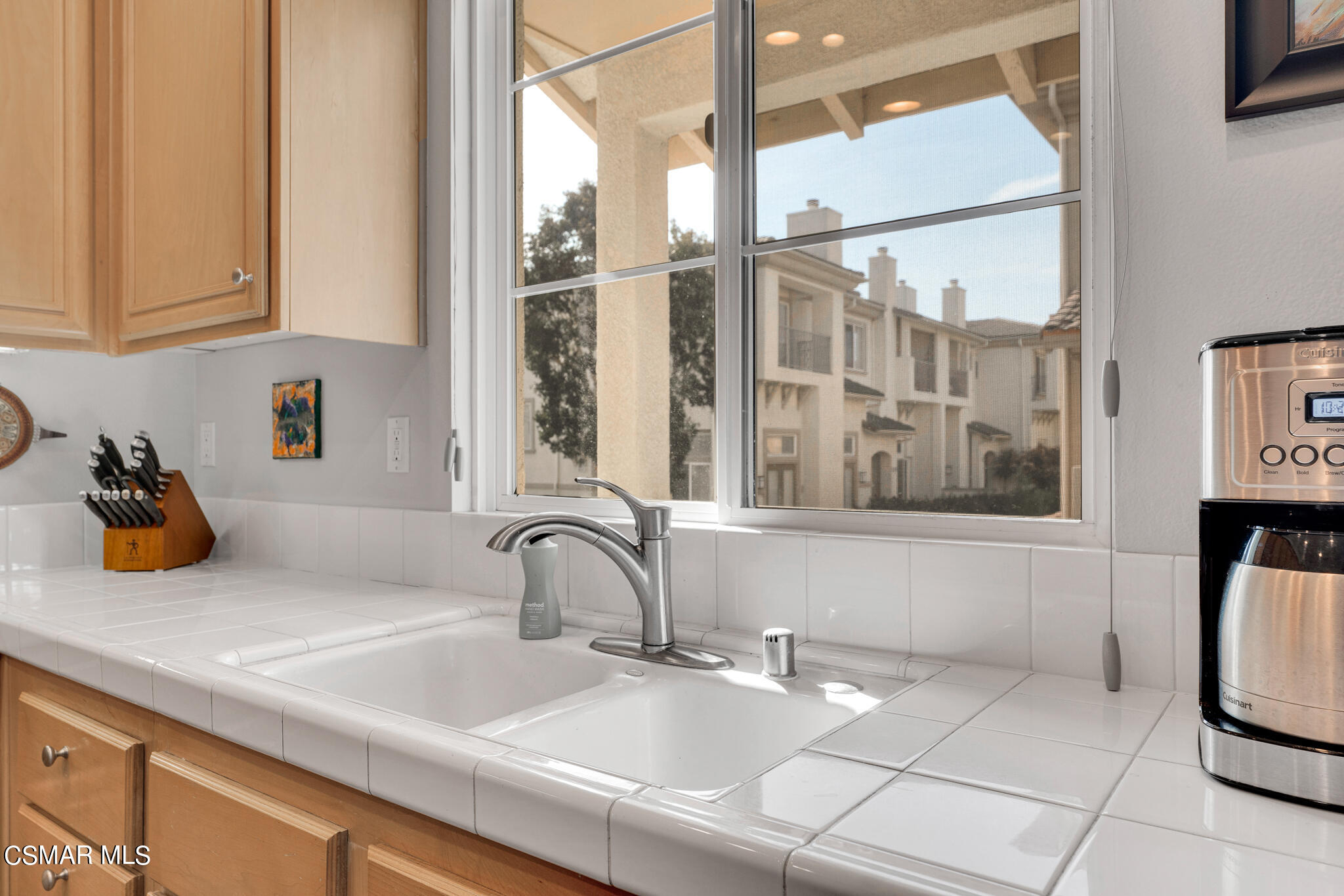 1233 Bayside Circle Oxnard, CA 93035 - Photo 16 of 37 a kitchen with a sink and a window