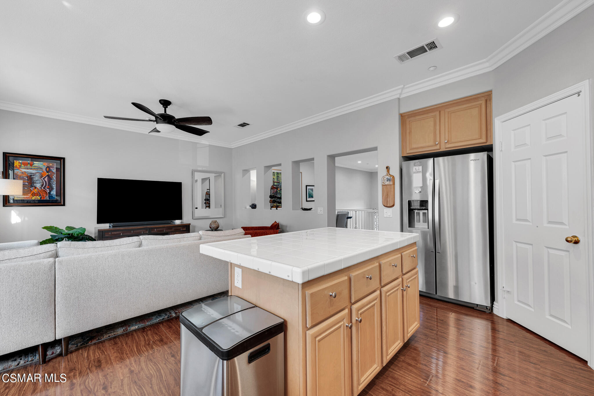 1233 Bayside Circle Oxnard, CA 93035 - Photo 17 of 37 a living room with stainless steel appliances kitchen island granite countertop a refrigerator a stove top oven a sink dishwasher and a refrigerator with wooden floor