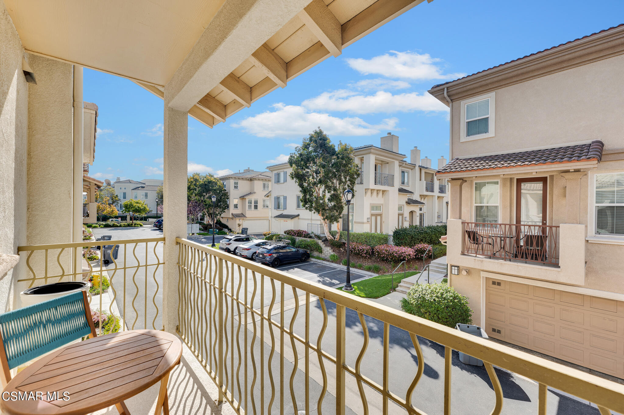 1233 Bayside Circle Oxnard, CA 93035 - Photo 18 of 37 a view of a chair and tables in the balcony