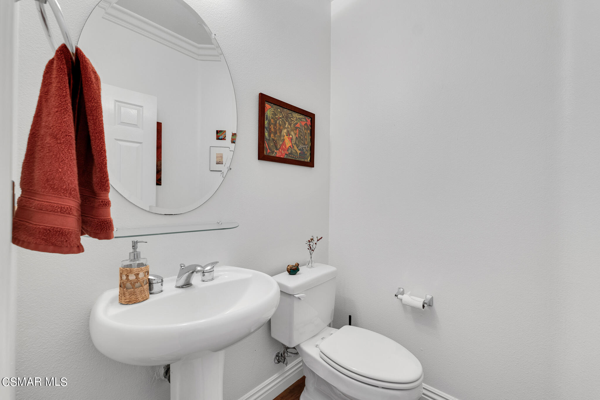 1233 Bayside Circle Oxnard, CA 93035 - Photo 19 of 37 a bathroom with a sink a toilet and a mirror