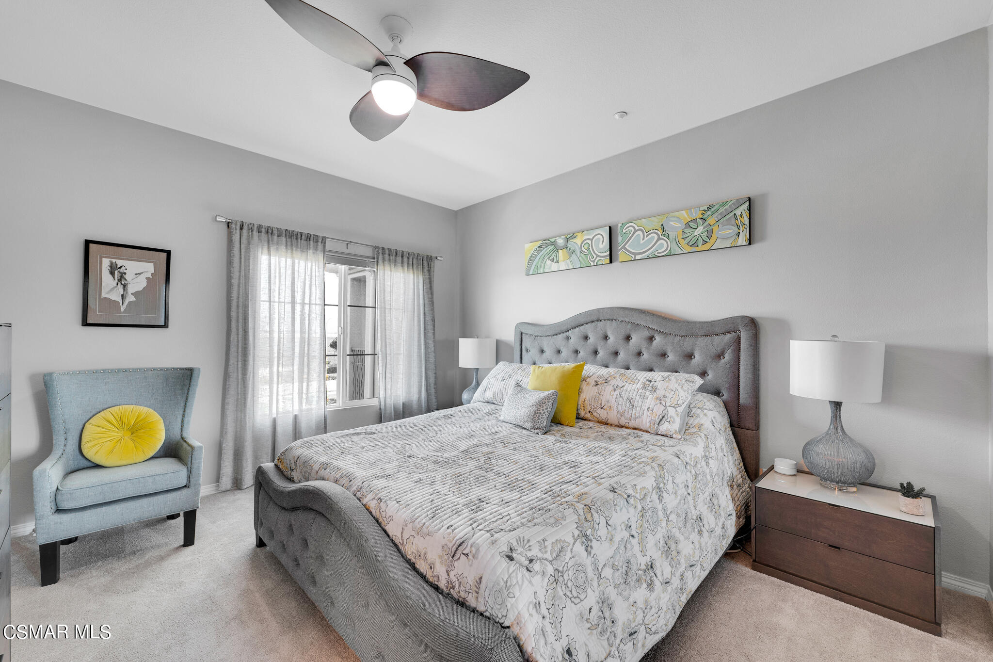 1233 Bayside Circle Oxnard, CA 93035 - Photo 20 of 37 a bedroom with a bed and a lamp