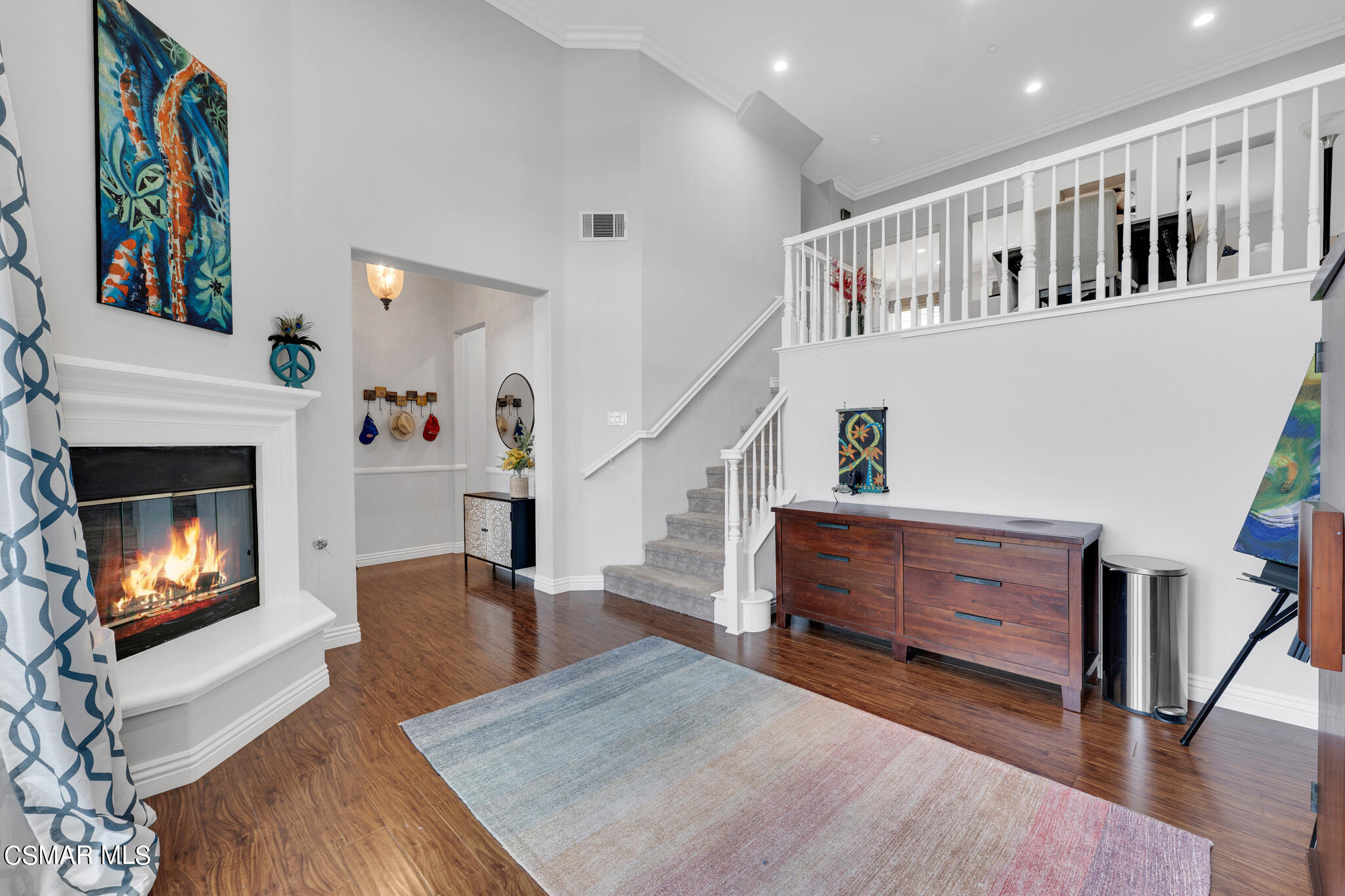 1233 Bayside Circle Oxnard, CA 93035 - Photo 2 of 37 a living room with furniture and a fireplace
