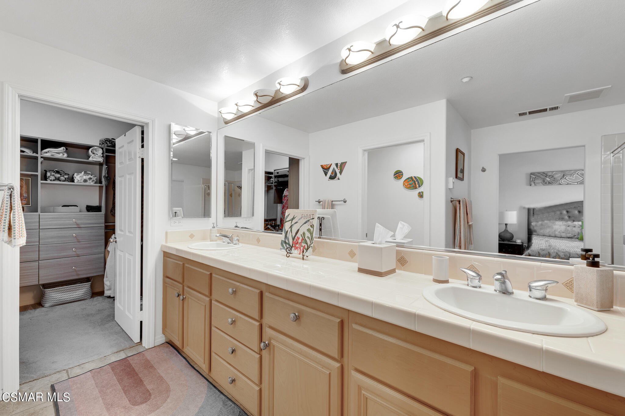 1233 Bayside Circle Oxnard, CA 93035 - Photo 23 of 37 a en suite bathroom with double sink and a large mirror